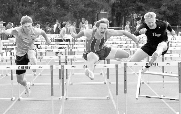 ABOVE: From left, Clearwater’s Landon Schill, Cheney’s Sam Johnson and Garden Plain’s Brant Long led the 100-meter hurdle finals on Friday in Cheney. Long was the winner, followed by Johnson and then Schill. BELOW: Clearwater’s Daphne Bullard runs a leg of the 4x800-meter relay. Travis Mounts/TSnews