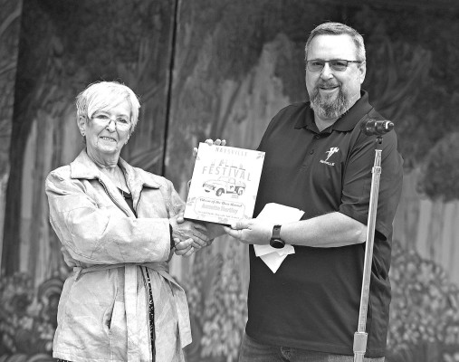 Annette Hartley receives a plaque from Haysville Mayor Russ Kessler recognizing her as the Haysville Citizen of the Year. Hartley received the honor at this year's Haysville Fall Festival. Stephanie McKennon/TSnews