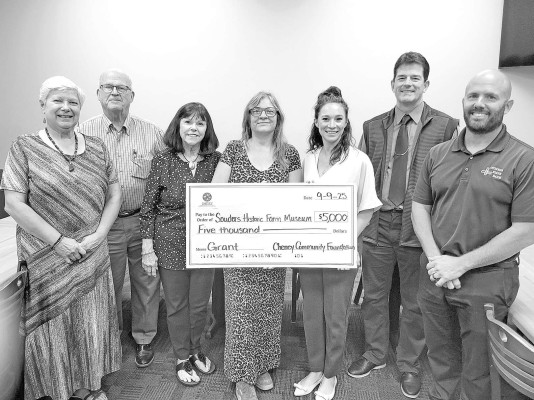 Members of the Cheney Community Foundation gathered last week to present Sounders Historic Farm Museum with a check for $5,000. Paul Rhodes/TSnews