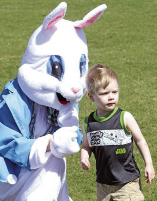 ABOVE: Damon Hayslip visits with the Easter Bunny during Haysville Recreation’s egg hunt Sunday Travis Mounts/TSnews