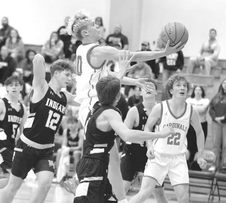 Grant Fisher drives through traffic during Conway Springs’ home game against Medicine Lodge. The Cardinals played well, rallying from 9 points down, but lost to the Indians in overtime. Stephanie McKennon/TSnews