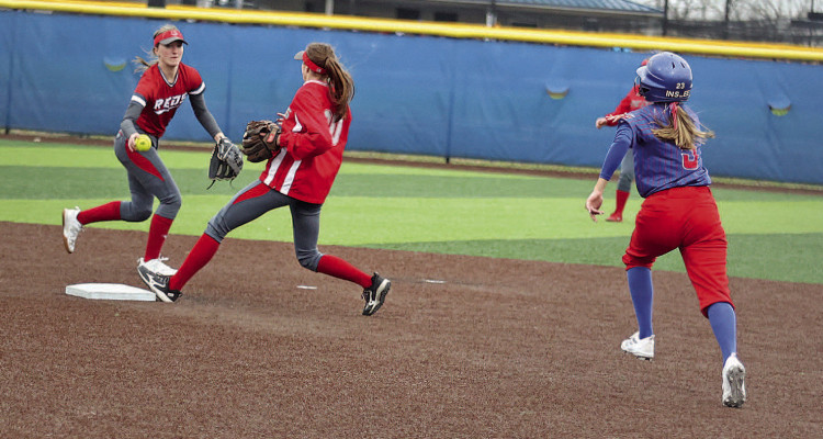 Conway Springs-Argonia short stop Reagan May delivers the ball to second baseman Tori Morrison for the first out in an attempted double play as Cheney’s Karstyn Inslee runs toward the bag. Stephanie McKennon/TSnews