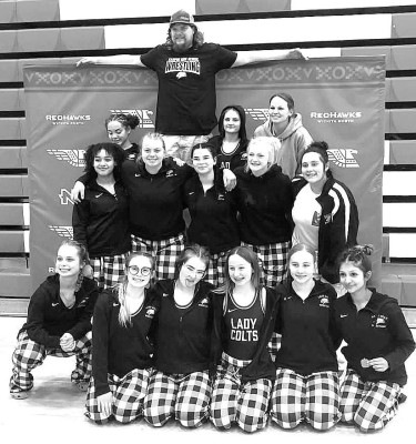 The Campus Colts girls wrestlers celebrate their team victory at Wichita North. Contributed photo