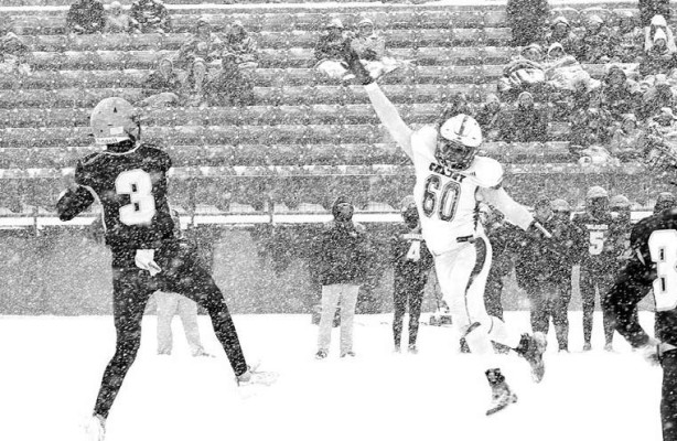 Cheney lineman Taj Thomas (60) puts pressure on Hayden quarterback Connor Hanika. Travis Mounts/TSnews