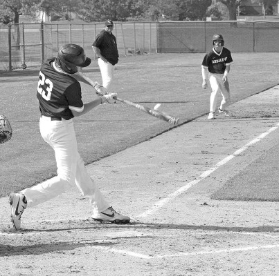 Andale-Garden Plain’s Jared Flax drives in a pair of runs during the first of two games at Clearwater last week on Thursday. The teams split the games. Travis Mounts/TSnews