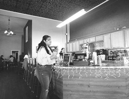 Customers idly chat at a locally owned coffee shop in Liberal. The business opened in 2022, but has struggled, and owner Shandon Classen hopes tools like AI can change that. Calen Moore/Kansas News Service