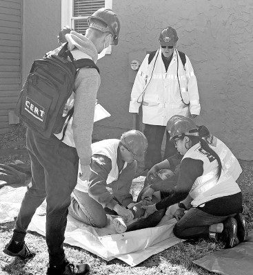 Students in the recent Community Emergency Response Team class in Cheney practice helping an injured person. Contributed photo