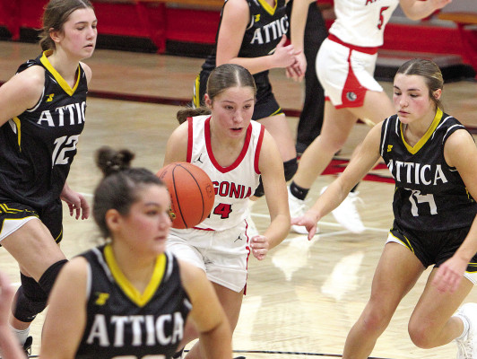Linden Greve of Argonia drives through a crowd of Attica defenders during last Friday’s home game.