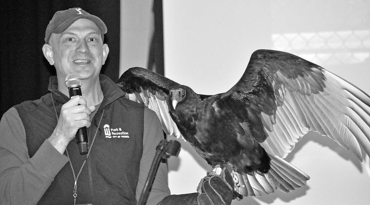 The guest speaker at the Sedgwick County Conservation District annual meeting was Todd Volkmann, the exhibit caretaker at the Kansas Wildlife Exhibit in Central Riverside Park. His companion for the presentation was Chuck the turkey vulture. Chuck made quite a statement when he spread his wings for the audience. Paul Rhodes/TSnews