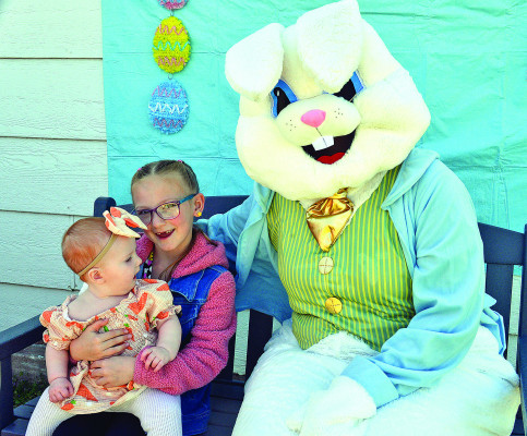 FAR LEFT: Grace and Jules Hawley get their photo taken with the Easter Bunny during last Saturday’s Easter egg hunt in Goddard, hosted by the Goddard Lions Club. See more photos on Page A4. Dale Stelz/TSnews