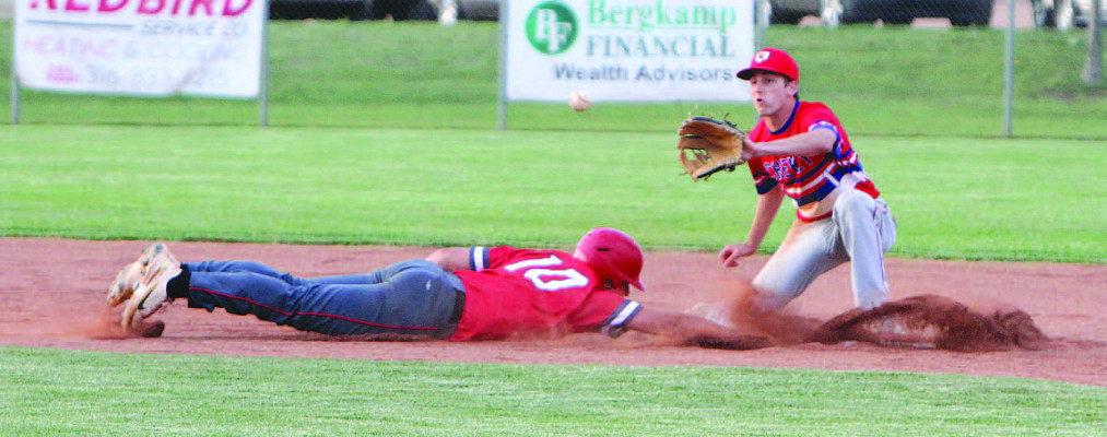 Conway Springs-Argonia Reds’ baserunner Dalton Morris slides safely back into second base under the tage of Cheney shortstop Cameron Eastman during last Thursday second game of a double header in Cheney. At the time, the Reds had just taken a 1-0 lead over the Cardinals. The Reds held on for a 3-1 victory, while the Cardinals won the opening game 10-0. Subscribers can see additional photos online at www.tsnews.com. Travis Mounts/TSnews