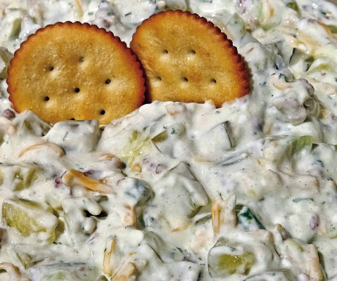 This pickle dip features lots of great pickle flavor, accentuated by bacon bits, fresh onions and lots of cheese.