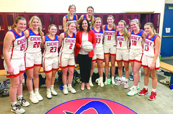 Sarah McCormick is pictured with the Cheney Cardinals after earning her 200th victory as a head basketball coach. She is retiring from coaching after successful runs at Cheney, Garden Plain and Scott City. Travis Mounts/TSnews