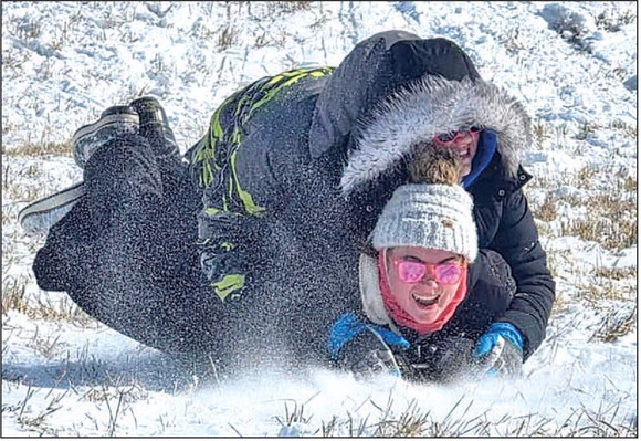 Three sledders are layered together for some sledding fun just outside of Cheney. Enjoying the ride are, from top, Kendall Foley, Avyn Grandy and Brooklyn Albers. Last weekend’s winter storm created a lot of scheduling chaos, especially for high school sports. In the end, dangerous cold and bitter wind chills were the biggest threat, as local snowfall amounts fell short of the 8-12 inches expected. See more reader photos on Page A10 and at www.facebook.com/TimesSentinel. Contributed photo/Kyle Grandy