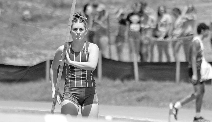 ABOVE: Cheney’s Katy Wehrman gets ready to for an attempt during the pole vault. She placed sixth in Class 3A, earning her second State medal in the event. BELOW: Andrea Blundell runs a leg of the 4x400 relay. Stephanie McKennon/TSnews