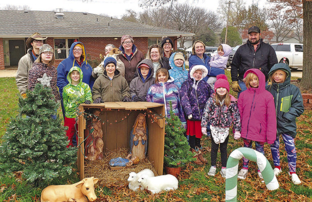 Cardinals 4-H members gather for a picture Dec. 2 at Spring View Manor after decorating outside for the residents to start their Christmas party. Contributed photo