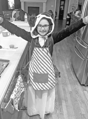 London Mounts, the niece of managing editor Travis Mounts, models many different costumes at once in what was referred to as a “seven layer dip of joy.” Contributed photo