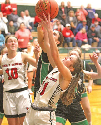Sadie Koester grabs a rebound just moments before scoring the winning basket in overtime against Mulvane. With the victory, Conway Springs was crowned as the Mulvane Wildcat Classic champion. Travis Mounts/TSnews