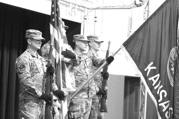 A color guard from McConnell Air Force Base presents the colors during a short ceremony at the Goddard Community Thanksgiving feast last Thursday. In addition to the ceremony, veterans had a special table of honor reserved for them. Travis Mounts/TSnews