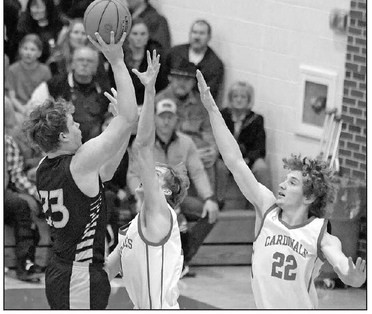 Brady Brack of Garden Plain shoots over a pair of Conway Springs defenders during last Friday’s game. Garden Plain won by 19 points to spoil Conway Springs’ homecoming night. Stephanie McKennon/TSnews