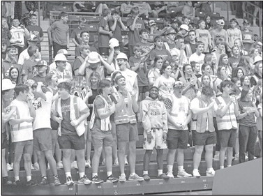 The Cheney High School student section cheers on the Cardinals during their State basketball game last Thursday at the Hutchinson Sports Arena. More photos will be posted soon online at www. tsnews.com. Travis Mounts/TSnews