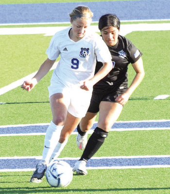 Sydney Puetz (9) keeps the ball away from a defender during an Independent Panthers’ soccer game earlier this season. Contributed photo