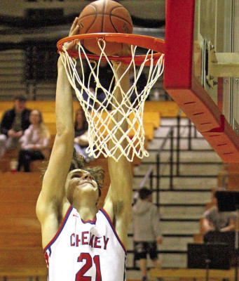Logan Wallace throws down a dunk during Cheney’s 53-point win over Douglass. Travis Mounts/TSnews