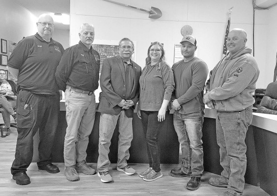 City officials from Wellington and Conway Springs gather for a photo after approval of an agreement covering takeover of EMS services for Conway Springs. Paul Rhodes/TSnews