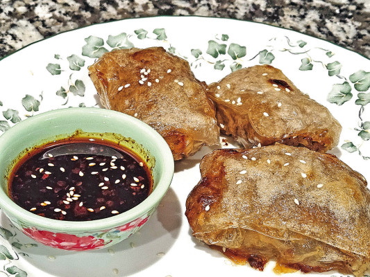Rice paper dumpling pockets take a lot of the work out of traditional Asian-style dumplings, but they pack all of the flavor. With a great combination of ground pork and shrimp, along with lots of great spices, these are a good, quick meal.