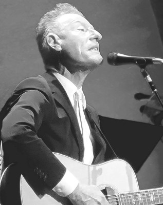 Music legend Lyle Lovett performs at The Cotillion last week. Lovett was the perfect example of yin and yang between Publisher Paul Rhodes and his grandson Felix. Paul Rhodes/TSnews