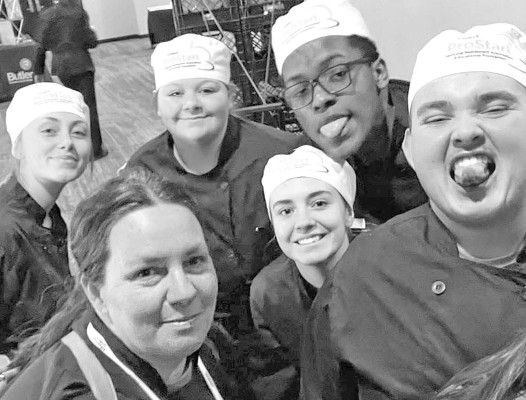 Teacher Brooke Ward, lower left, has been inducted into the National High School BBQ Hall of Fame. She is pictured with some of her culinary students at Campus High School. Contributed photo