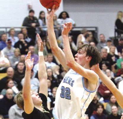 The Tigers’ Larsen Schneider scores a firsthalf jump shot during Friday’s home game against Andover Central. The Tigers lost that game, and also suffered a defeat against Andover High earlier in the week. Travis Mounts/TSnews