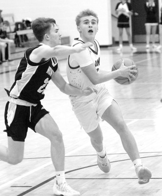 Lawson Davis of Goddard drives to the basket during the Lions’ winter homecoming game last Friday against Newton. Travis Mounts/TSnews