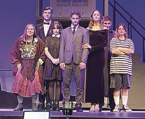 Makenzy Carter of Haysville, a student at Sterling College, will portray Pugsley in this weekend's production of “The Addams Family Musical.” Carter is pictured at right in partial costume. Contributed photo