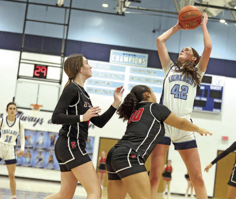 Justine Berlin of Clearwater shoots over two defenders during the Indians’ Friday win. Stephanie McKennon/TSnews