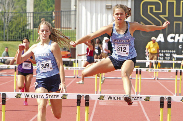 LEFT: Teammates Kenzy McArtor, left, and Madison Williams race side by side in Friday’s preliminary of the Class 4A 100-meter hurdles. Williams won both the 100- and 300-meter hurdles on Saturdy, and McArtor placed in both races. Williams and McArtor each placed in three individual events. 