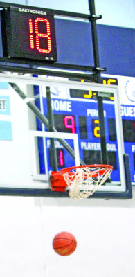 A basket is made with 18 seconds left on the shot clock during a December game between Clearwater and Rose Hill. Travis Mounts/TSnews