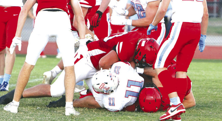 Conway Springs defenders bring down a Trinity Celtic runner during the first half of Friday’s home victory. The Cardinals beat Trinity 35 to improve to 5-0 and remain as the No. 1-ranked team in Class 1A in most polls. Travis Mounts/TSnews