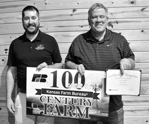 Lynden Speer, right, accepts the Centennial Award for Maplewood Farms and owner Charleene Briggs. The farm is located west of Clearwater. Dale Stelz/TSnews