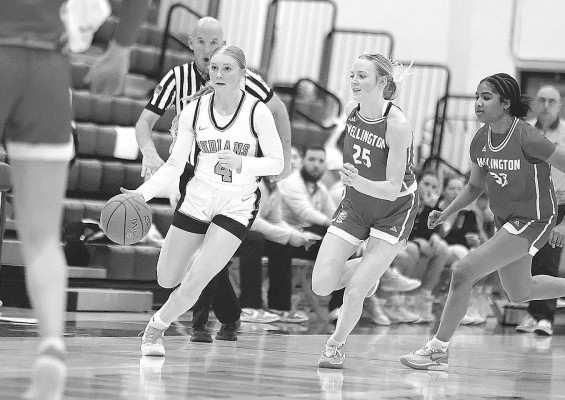 Madison Clevenger pushes the ball upcourt during Friday’s homecoming game against rival Wellington. Stephanie McKennon/TSnews