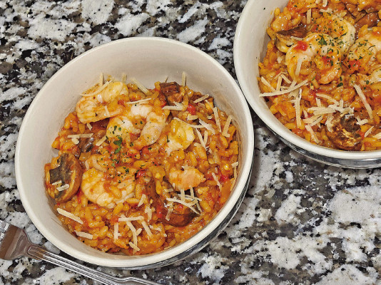 Red pepper risotto features roasted red bell peppers that melt with fresh parmesan into a creamy, delicious dish that can be paired with everything from mushrooms to shrimp to sausage for dinner.