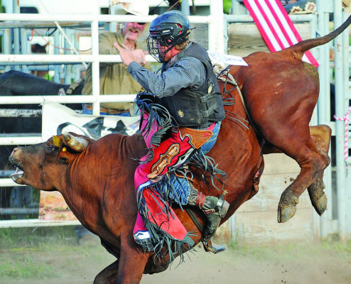 ABOVE: Devon Weber of Pratt tries to hit eight seconds during his turn at the Bull Jam last Saturday in Cheney, which was hosted by the Cheney Saddle Club. BELOW: Ella Sage practices roping a bull. Dale Stelz/TSnews