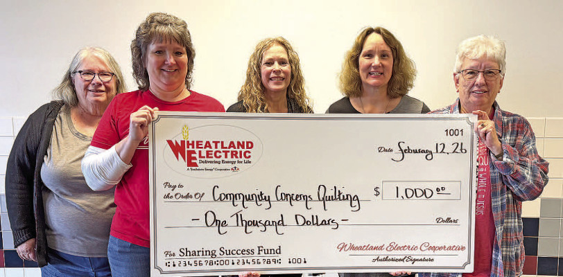 Community Concerns Quilting, represented from left by Jeanette Achenbach, Dawn Hartman, Laura Bender and Jeanne Dennett, was awarded a Sharing Success grant, presented by Mary Hoisington (middle), member service and key accounts manager at Wheatland Electric Cooperative. Grant funds will be used to purchase quilt batting and materials used in the creation of handmade quilts for individuals and families in need. Contributed photo