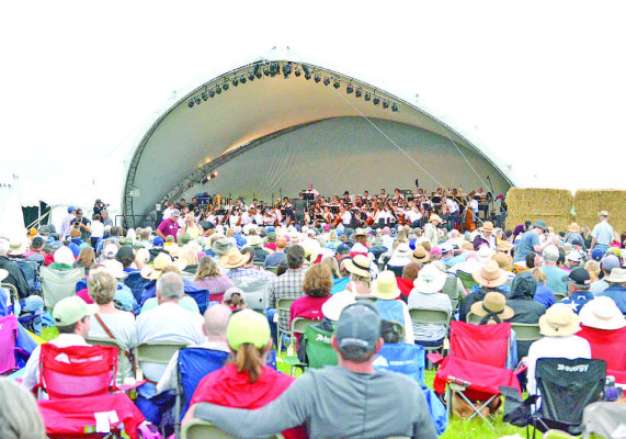 Members of the Kansas City Symphony Orchestra perform Saturday evening during the 2023 Symphony in the Flint Hills event. This year’s signature event was held in Wade Pasture in Wabaunsee County, and the day was filled with educational presentations, live music, wagon rides and authentic Powwow dancing. Watch for more photos and a story in next week’s TSnews, and the July East Wichita News and WestSide Story. Paul Rhodes/TSnews
