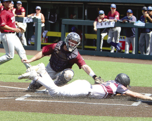 The Haysville Aviators’ Brock Lulewicz slides safely into home during Monday’s game against the Santa Barbara Foresters. The Foresters won a high-scoring game 12-6. The Aviators finished pool play with a 2-1 record, beating the Seattle Blackfins on Friday and getting past the GPS Legends early Sunday moring on a sacrifice RBI. The Aviators’ next game had not been determined at press time Tuesday evening. Bracket play began on Wednesday. Read more in Sports, Page A9. Dale Stelz/TSnews