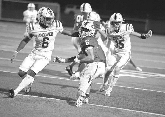 Goddard’s Kamren Loch spinds out of a tackle during Friday’s homecoming game. The Lions came back for a 14-13 victory over visiting Andover.