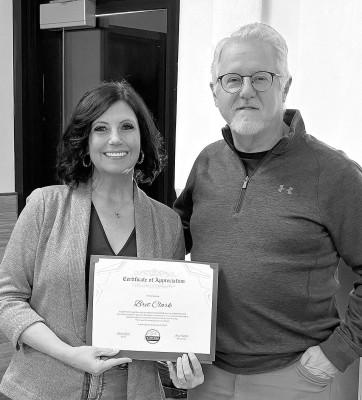 Rachel Janes, Chamber chairperson, presents a Certificate of Appreciation to long-time Chamber member Bret Clark for his years of service to the Chamber and the community. Clark recently retired from The Valley State Bank. Contributed photo
