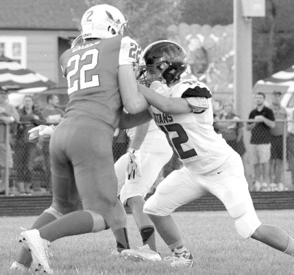 Lincoln Warner blocks a defender during the Argonia-Attica Titans’ road victory against the Norwich Eagles. The Titans are 1-0 in district play and 3-1 overall. Contributed photo