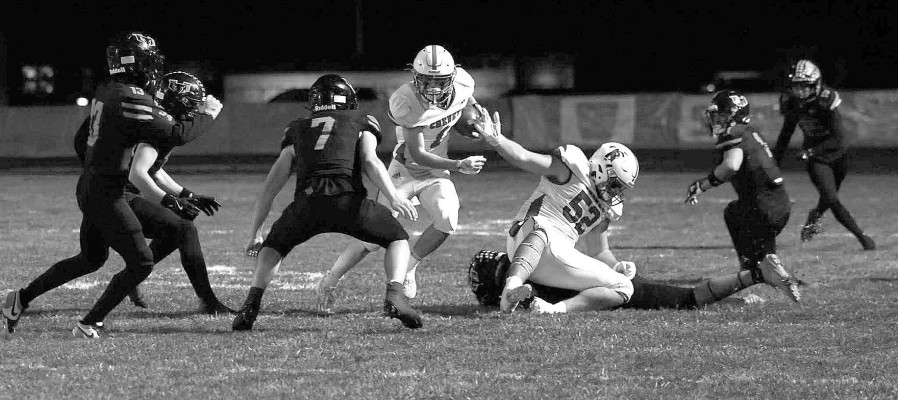 Deitric McDaniel runs for a big gain during Cheney’s playoff victory at Holcomb. The Cardinals topped the Longhorns to avenge their season-opening loss. Andrea McDaniel/TSnews