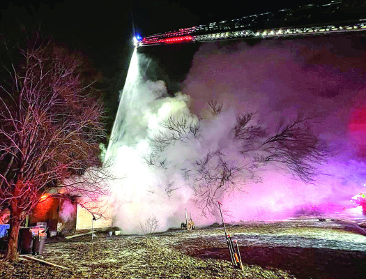 Firefighters from Clearwater and Sedgwick County worked to extinguish this house fire late Tuesday into early Wednesday last week. A donation event to help the residents will be held this Saturday. Contributed photo/Clearwater Fire